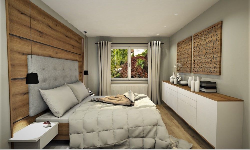 Schlafzimmer mit Doppelbett und Sideboard